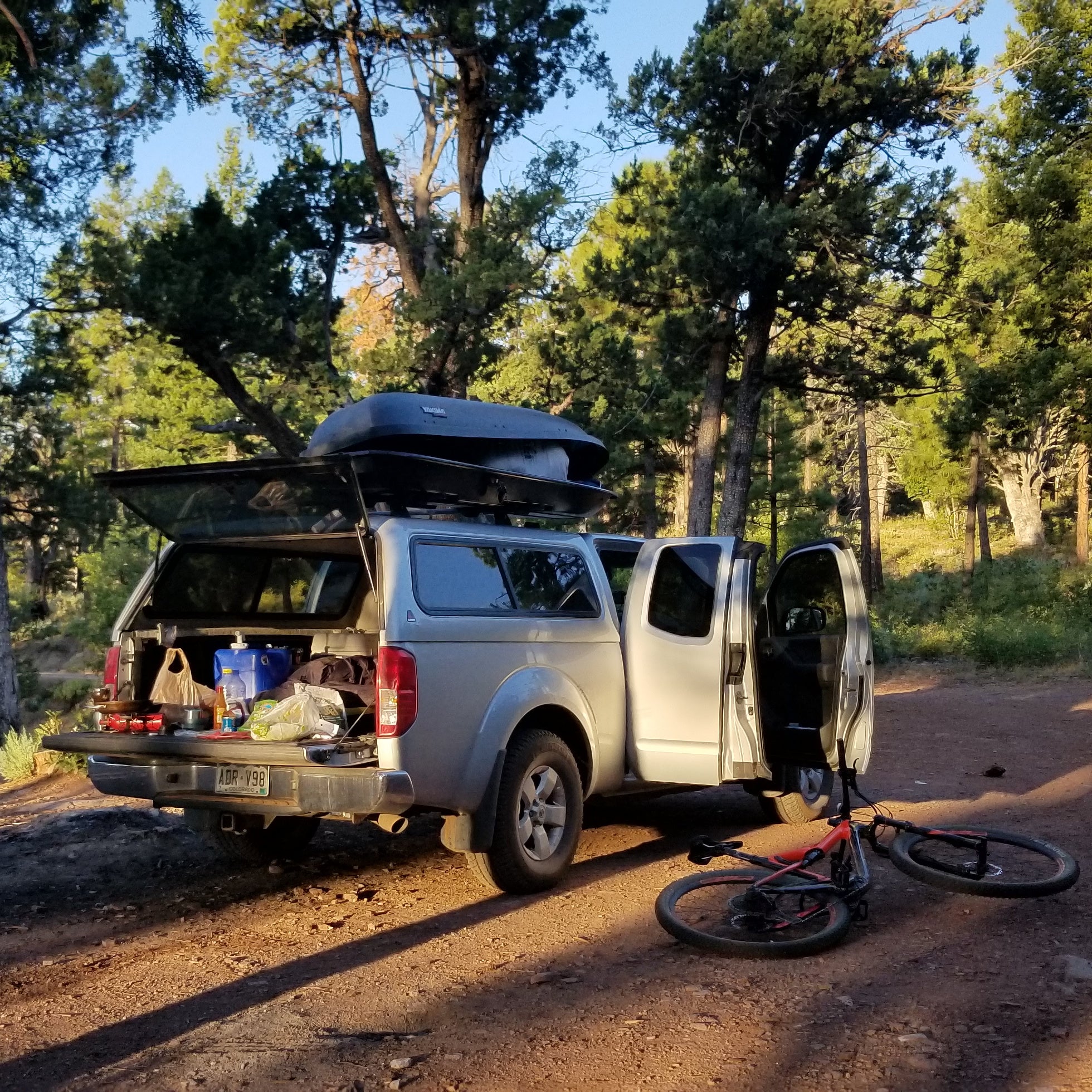 truck bed open ready for car camping with mountain bike on side